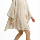 Alma Poncho in beige net, side view