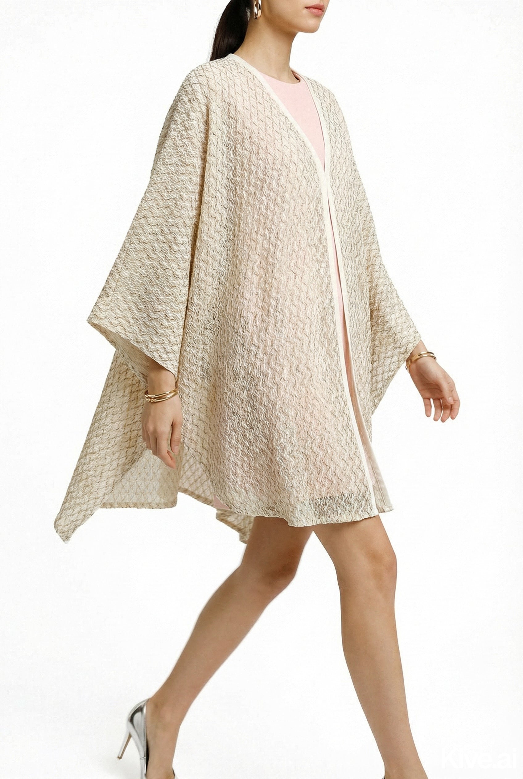 Alma Poncho in beige net, side view