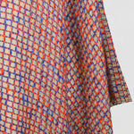 Alma Poncho in orange and blue, detail