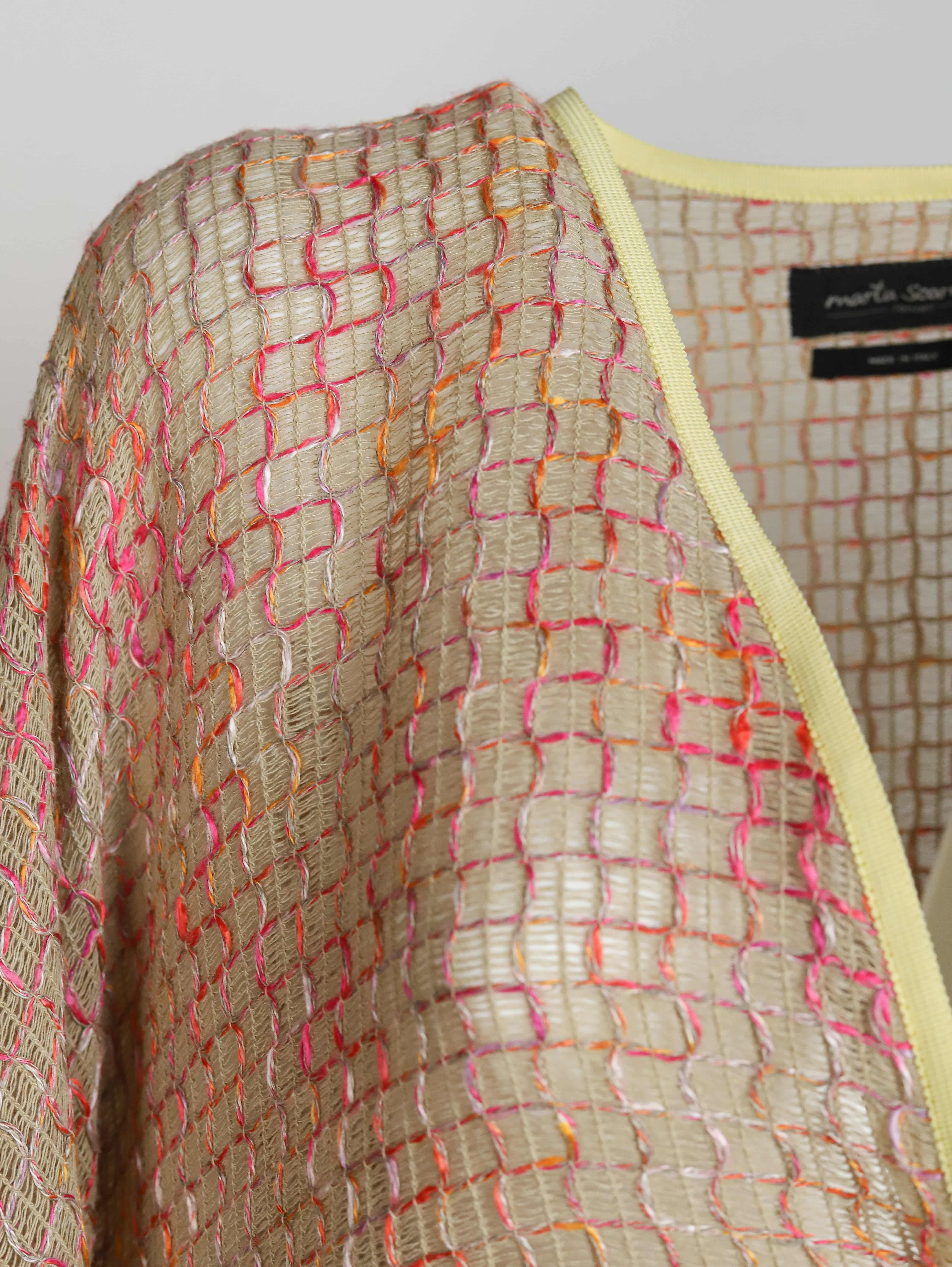 Alma Poncho in pink and yellow, close-up