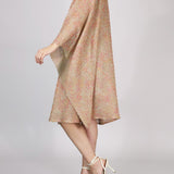 Alma Poncho in pink and yellow, side view
