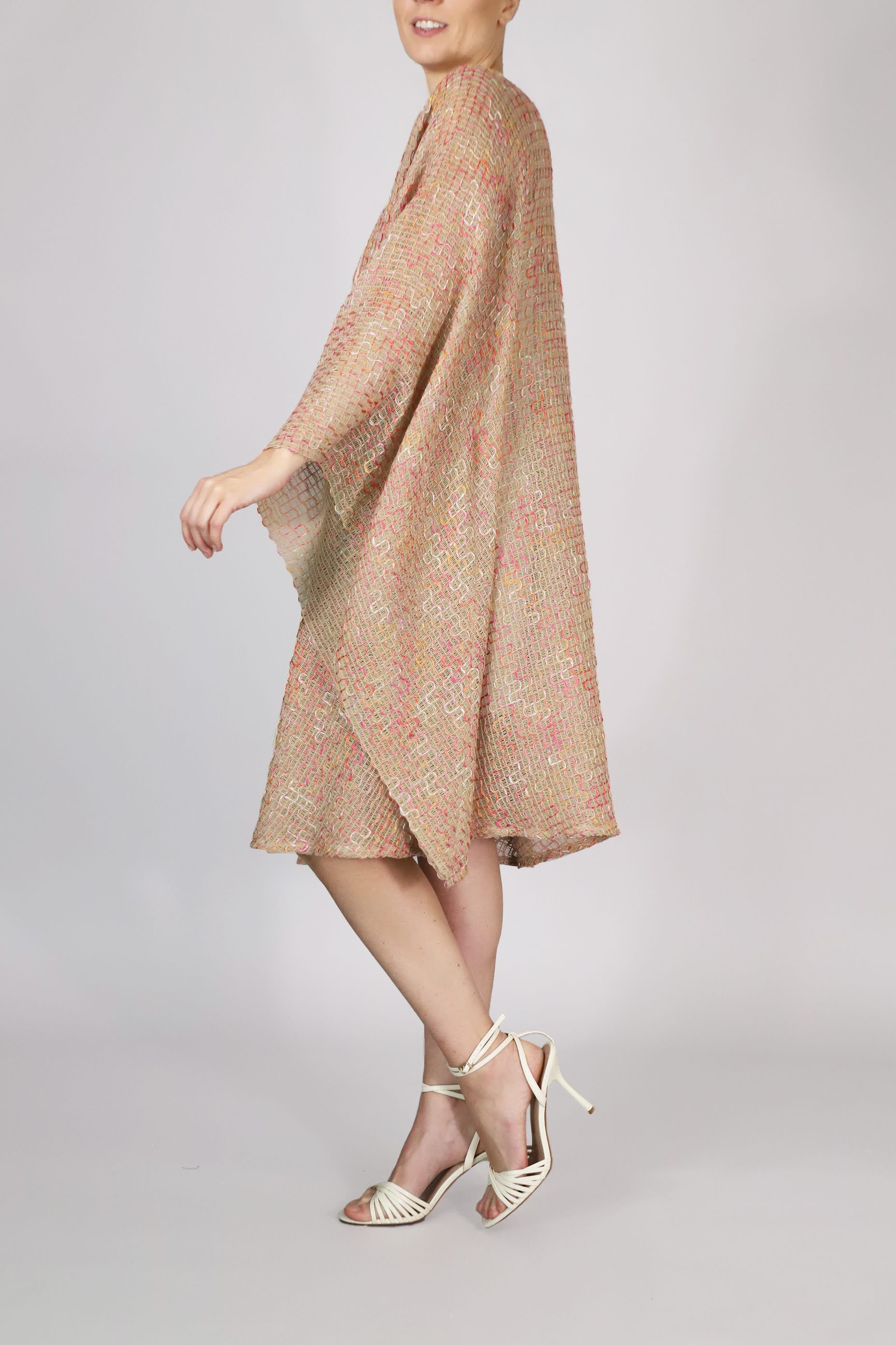 Alma Poncho in pink and yellow, side view